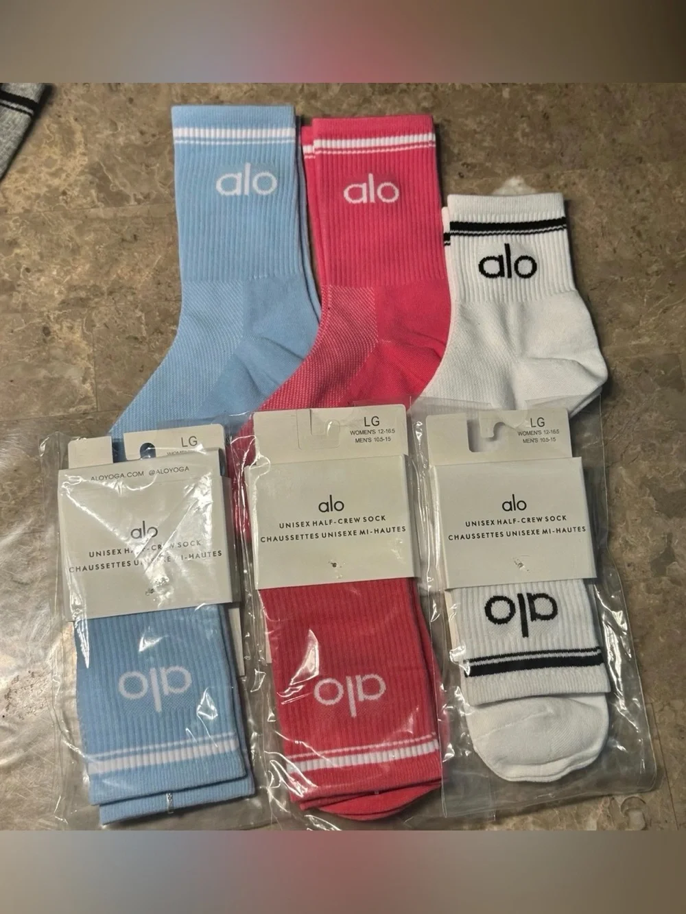 Women’s Alo Socks 3 pairs Packaging states size Large but they fit sizes 6-11